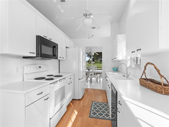 kitchen with light wood-type flooring, white appliances, ceiling fan, sink, and white cabinets