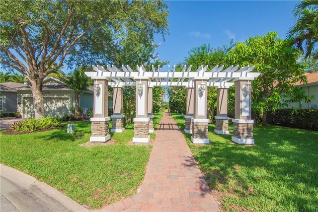 view of front facade featuring a pergola and a front yard