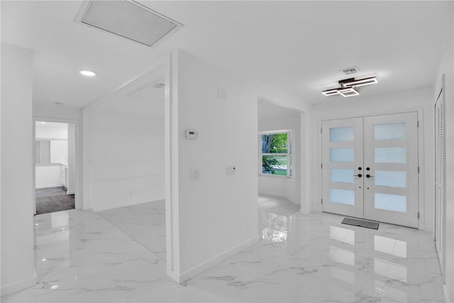 entryway with marble finish floor, baseboards, visible vents, and french doors