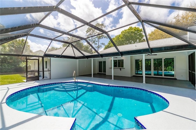 outdoor pool featuring a lanai and a patio