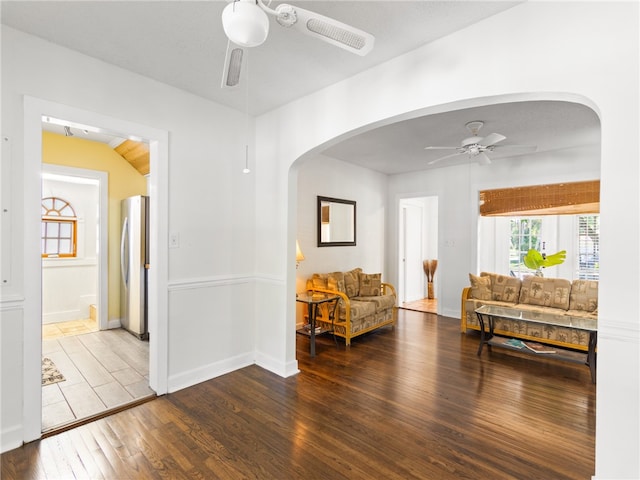 interior space with hardwood / wood-style flooring, ceiling fan, lofted ceiling, and a textured ceiling