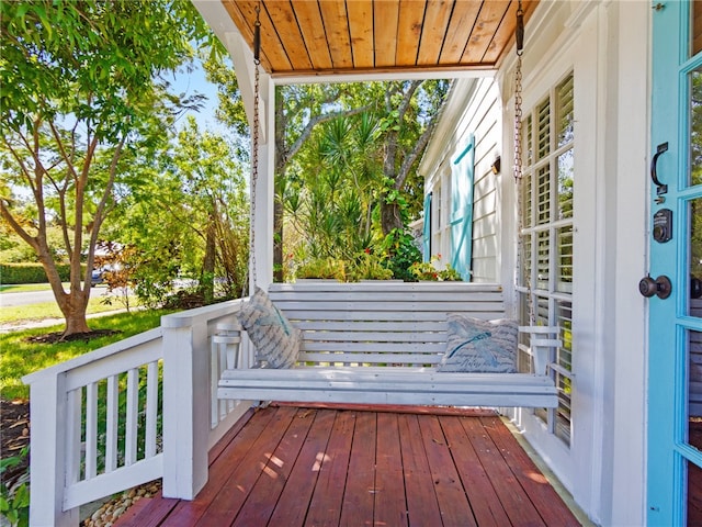 wooden terrace featuring a porch