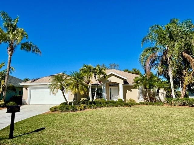 ranch-style home featuring a front yard and a garage