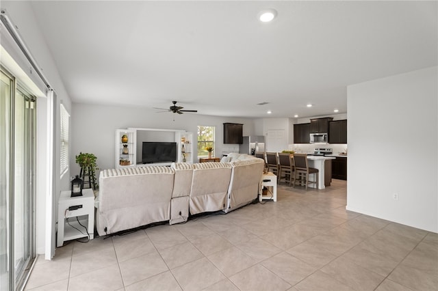 1093 Wabash Rd SE, Palm Bay, FL 32909 - living area featuring a ceiling fan, light tile patterned floors, and recessed lighting