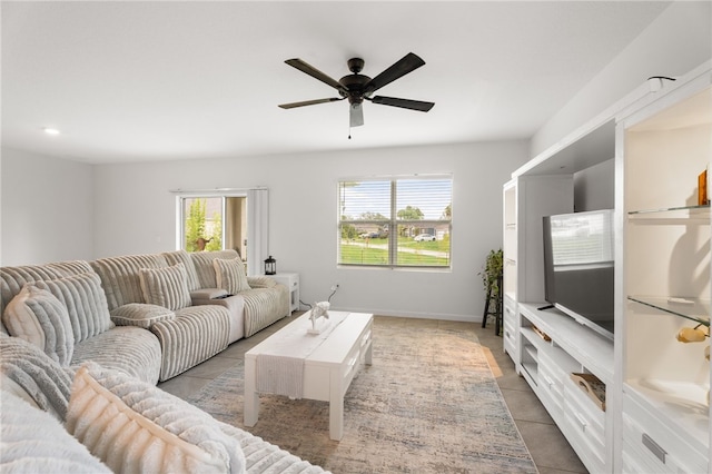 1093 Wabash Rd SE, Palm Bay, FL 32909 - living area with light tile patterned floors and a ceiling fan
