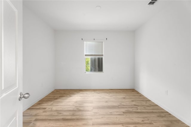 1093 Wabash Rd SE, Palm Bay, FL 32909 - spare room featuring light wood-style floors and baseboards