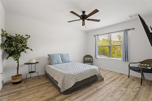 1093 Wabash Rd SE, Palm Bay, FL 32909 - bedroom with wood finished floors, baseboards, and ceiling fan