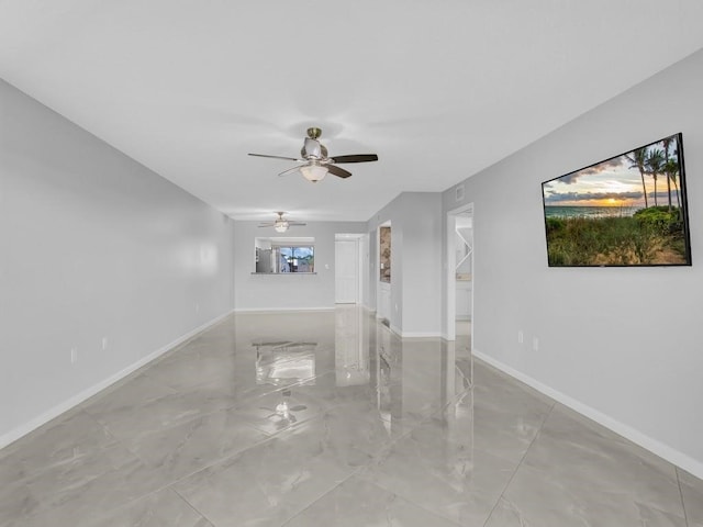 unfurnished living room featuring ceiling fan