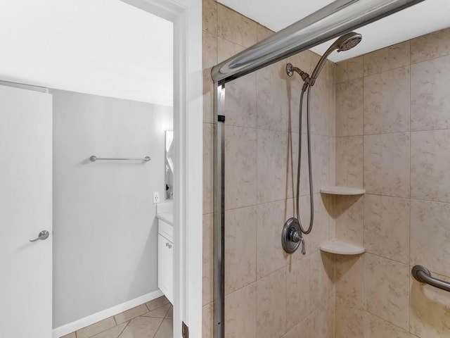 bathroom featuring vanity, tile patterned flooring, and a shower with door