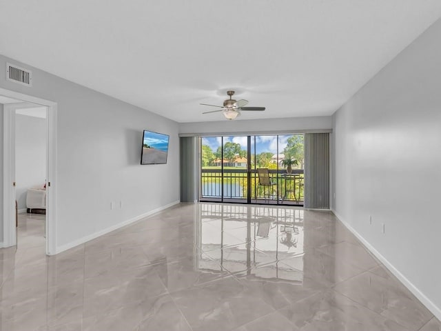 spare room with ceiling fan