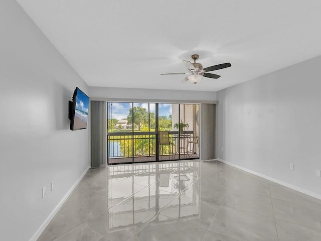 spare room featuring ceiling fan