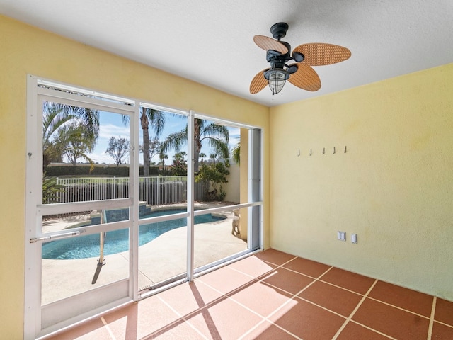 view of pool featuring ceiling fan