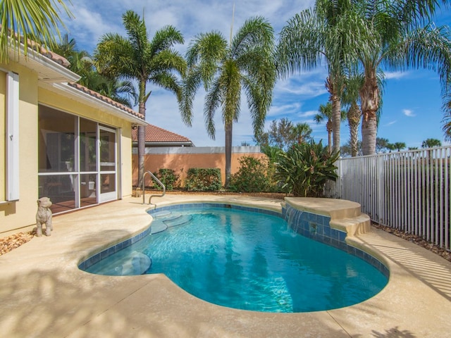 view of swimming pool featuring a patio area and pool water feature