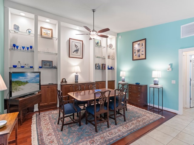 tiled dining room with ceiling fan