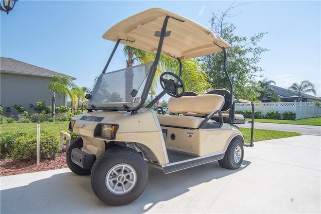 1440 Carriage Ct, Vero Beach, FL 32966 - view of parking / parking lot featuring fence