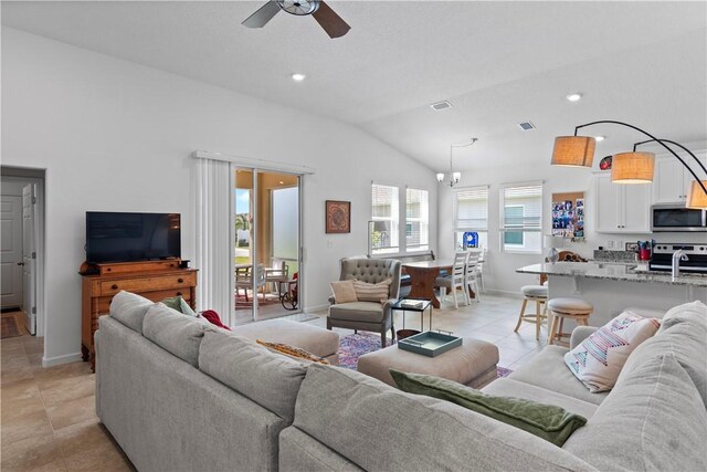 1440 Carriage Ct, Vero Beach, FL 32966 - living area with vaulted ceiling, ceiling fan, light tile patterned flooring, baseboards, and recessed lighting