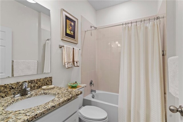 1440 Carriage Ct, Vero Beach, FL 32966 - full bath with shower / bath combination with curtain, toilet, and vanity