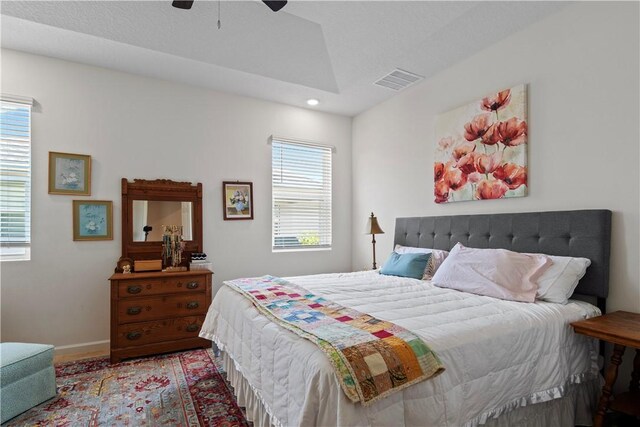 1440 Carriage Ct, Vero Beach, FL 32966 - bedroom featuring recessed lighting, a ceiling fan, wood finished floors, baseboards, and vaulted ceiling