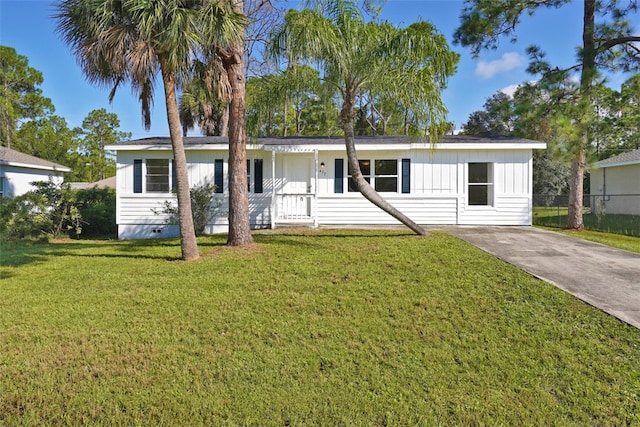 single story home with a front yard