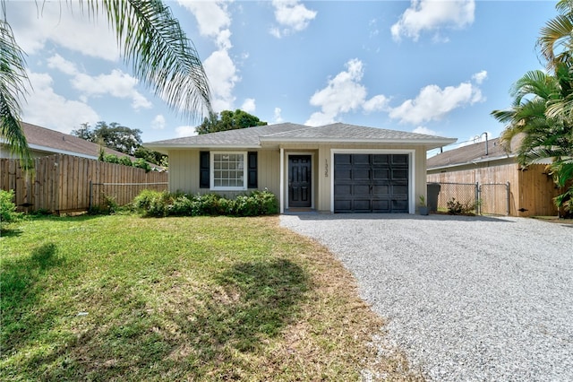 ranch-style home with a front lawn and a garage