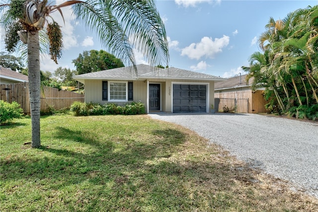 single story home with a garage and a front yard