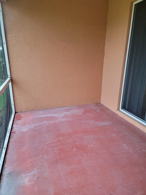 view of patio featuring a balcony