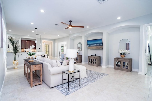 living room featuring ceiling fan