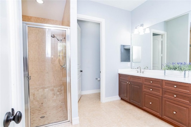 bathroom featuring vanity and a shower with door