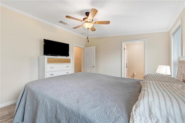 bedroom with hardwood / wood-style flooring, ceiling fan, and crown molding