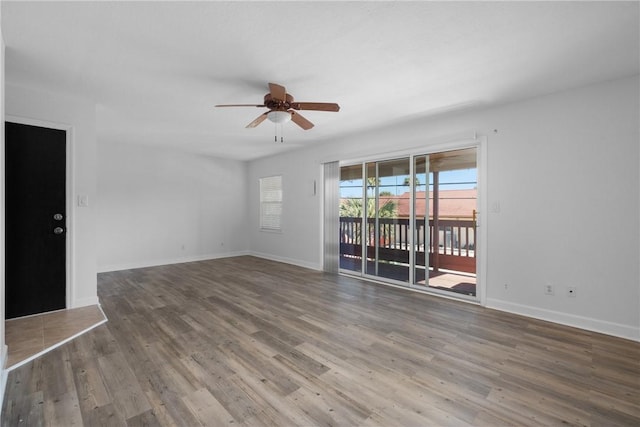 spare room featuring ceiling fan and hardwood / wood-style flooring