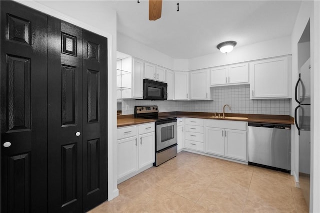 kitchen with white cabinetry, sink, ceiling fan, and appliances with stainless steel finishes