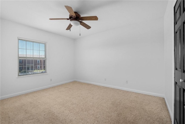 unfurnished room featuring carpet flooring and ceiling fan