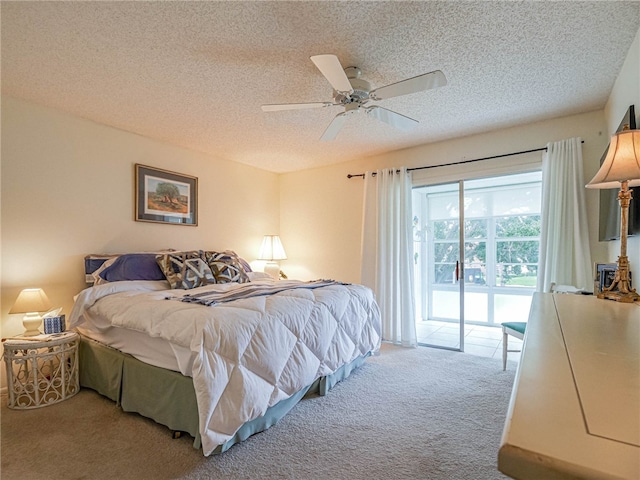 bedroom featuring carpet flooring, access to exterior, ceiling fan, and a textured ceiling