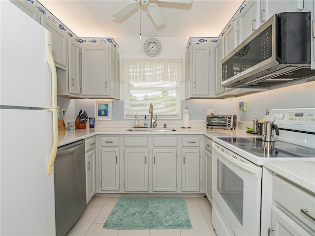 kitchen with ceiling fan, light tile patterned floors, sink, and appliances with stainless steel finishes