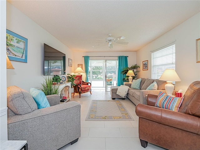 living room featuring ceiling fan and light tile patterned flooring