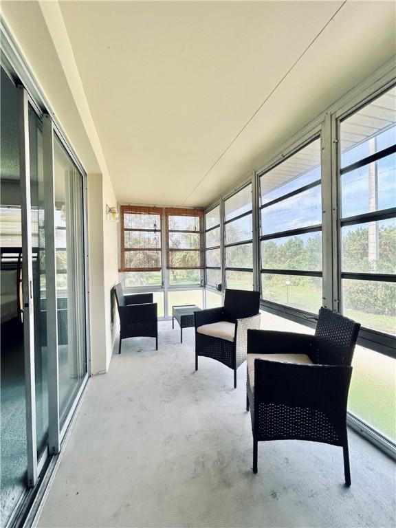 unfurnished sunroom with plenty of natural light