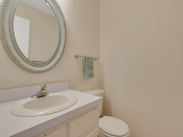 half bath with vanity and toilet