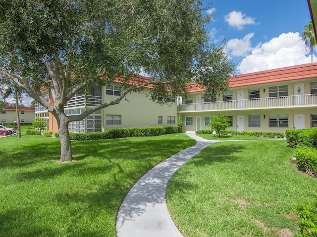 view of community featuring a lawn