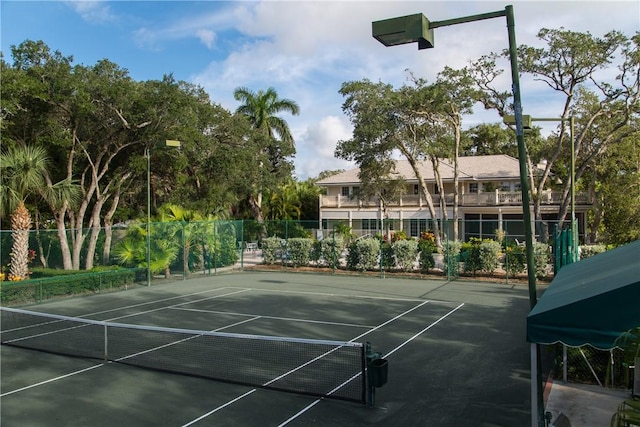 view of sport court featuring fence