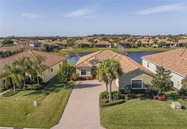 birds eye view of property with a water view