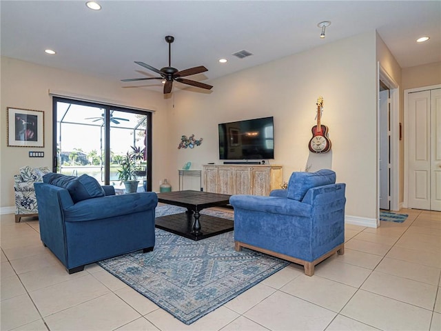 living area with light tile patterned flooring, recessed lighting, a ceiling fan, baseboards, and visible vents