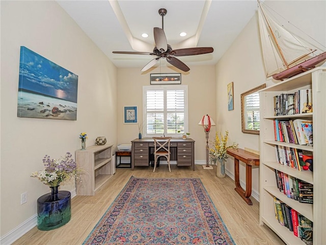 office area featuring light wood-type flooring, baseboards, and a wealth of natural light