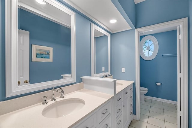 bathroom featuring vanity, tile patterned flooring, and toilet