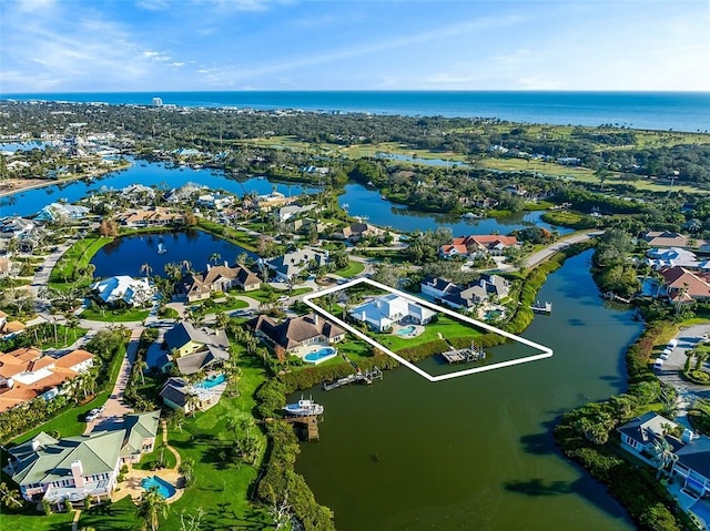 aerial view featuring a water view and a residential view