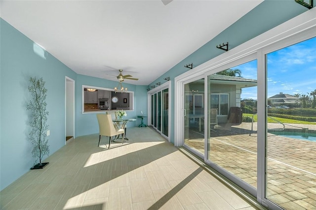 interior space with ceiling fan