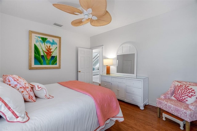 bedroom with hardwood / wood-style flooring and ceiling fan