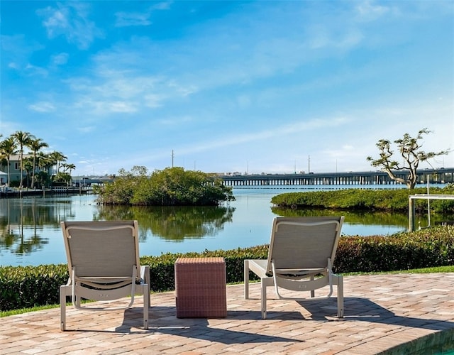 view of patio featuring a water view