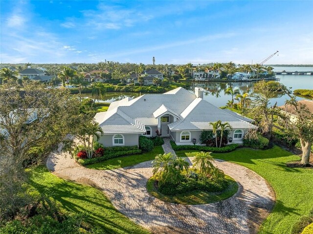 birds eye view of property with a water view