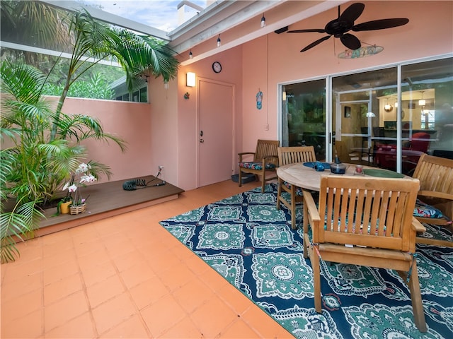 view of patio featuring ceiling fan