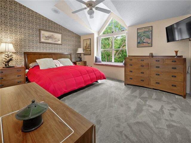 carpeted bedroom with lofted ceiling and ceiling fan